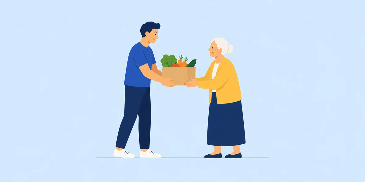 Volunteer giving groceries to an older woman